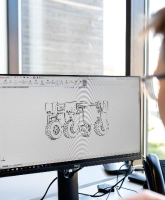  Student looking at computer screen with robot drawing on it. 